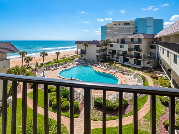 Panoramic balcony view over the pool and Atlantic Ocean
